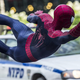 Spider-man singing off a police car.
